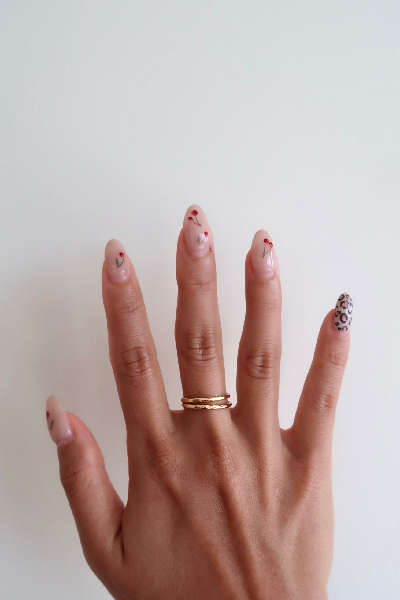 Double stacked classic gold rings on model