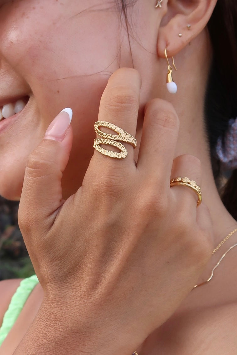 hand hammered snake shaped gold ring on model