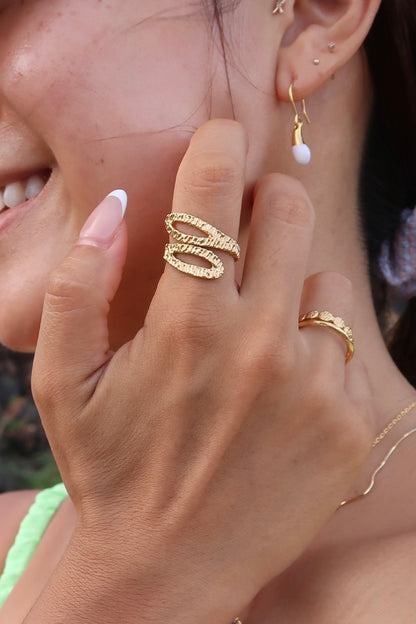 hand hammered snake shaped gold ring on model